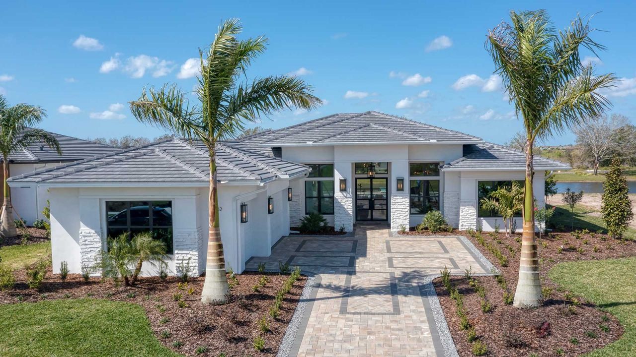 Front exterior of a home in the Star Farms community, located in Lakewood Ranch, FL (Image 2).