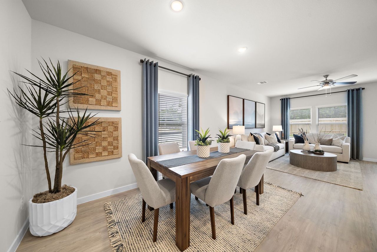 A dining room with a large table. A dining room with a large table.