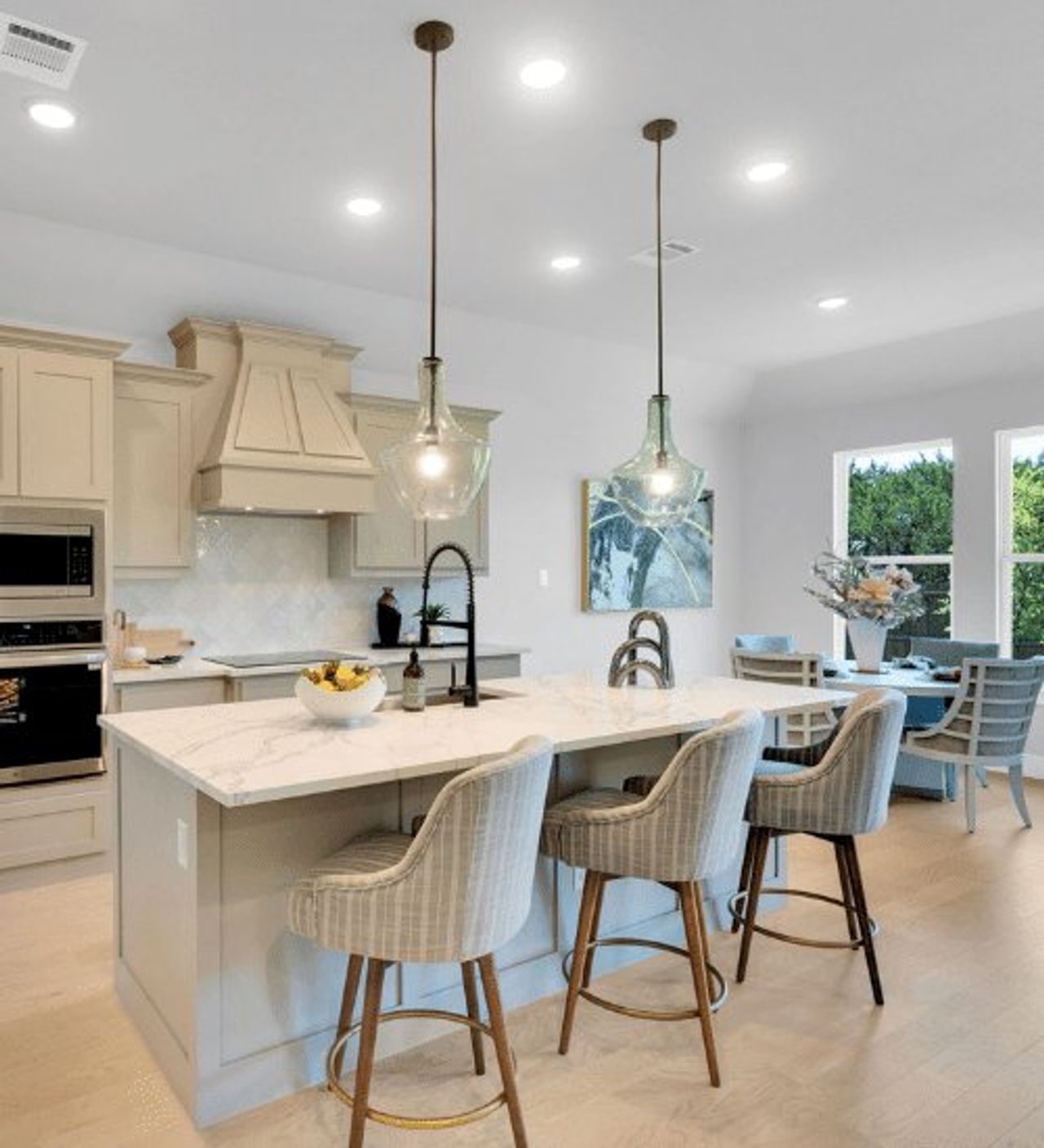 Furnished interior in a model home at Ten Mile Creek in DeSoto (Image 2).