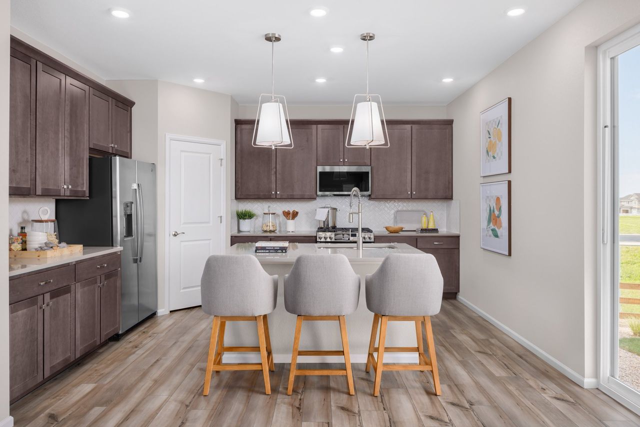 Furnished interior in a model home at The Legacy Collection at Harvest Crossing in Aurora (Image 2).