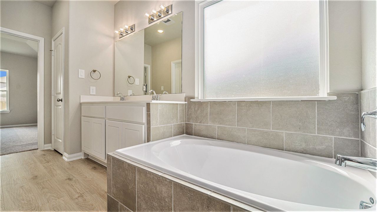 Furnished interior in a model home at Meadow Glen in Conroe (Image 2).