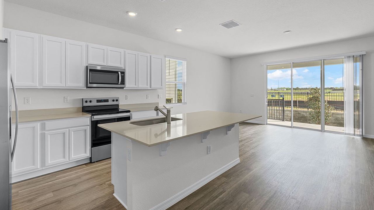 Furnished interior in a model home at Citrus Ridge in Davenport (Image 2).