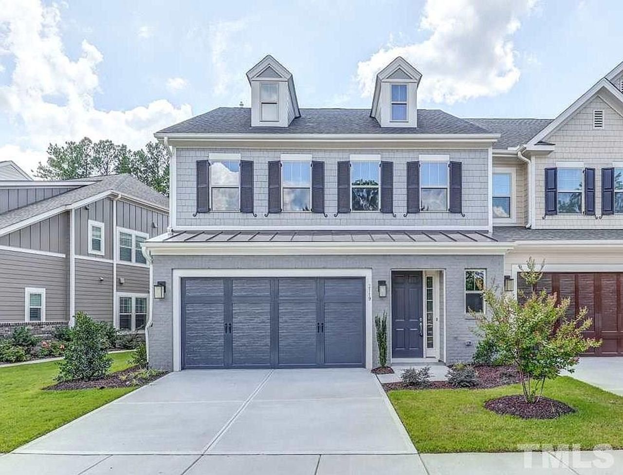 Front exterior of a home in the Fairway Villas at Croasdaile - Durham - Robuck Homes community, located in Garner, NC (Image 2).