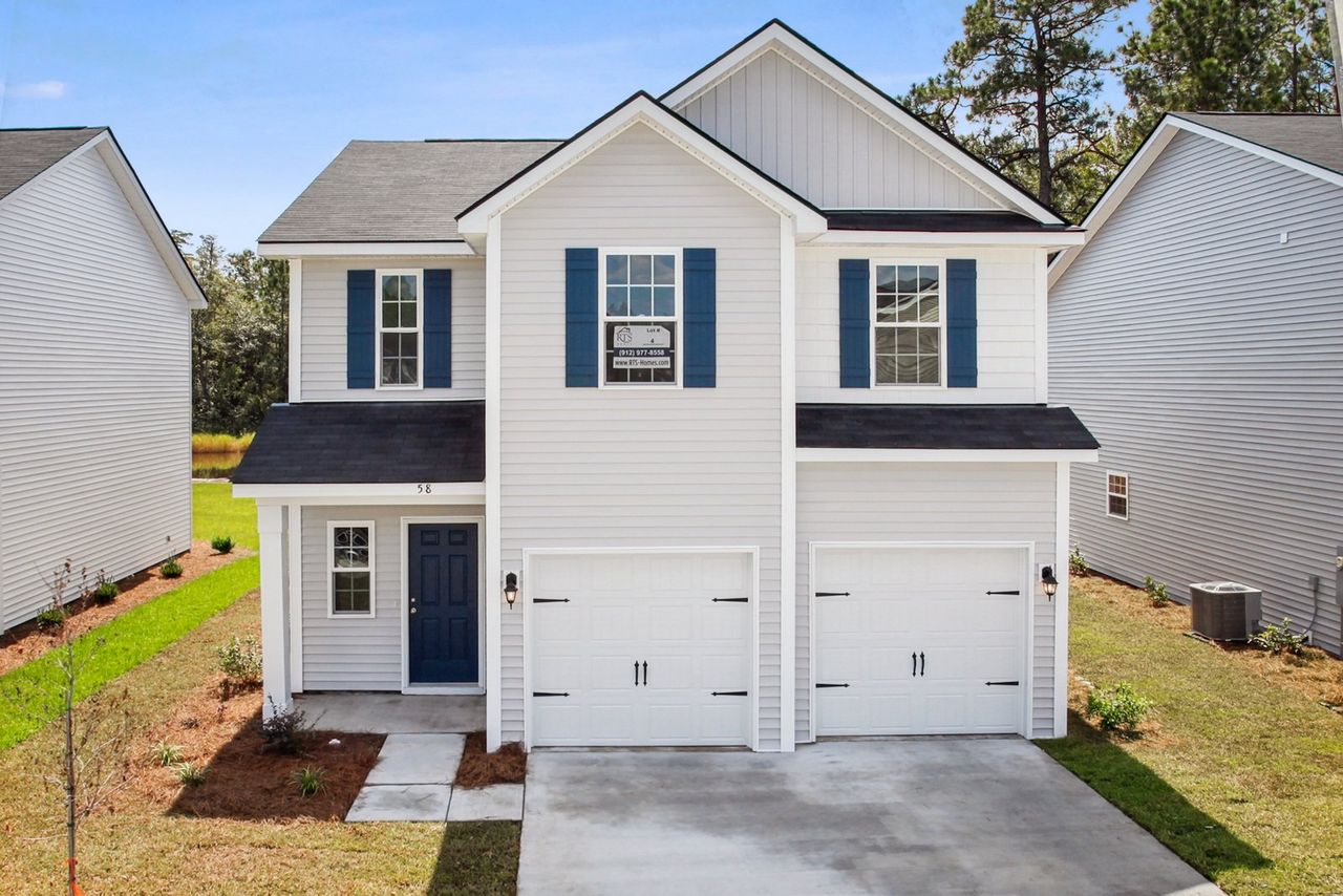 Front exterior of a home in the The Pointe at Villages on Marne community, located in Hinesville, GA (Image 2).