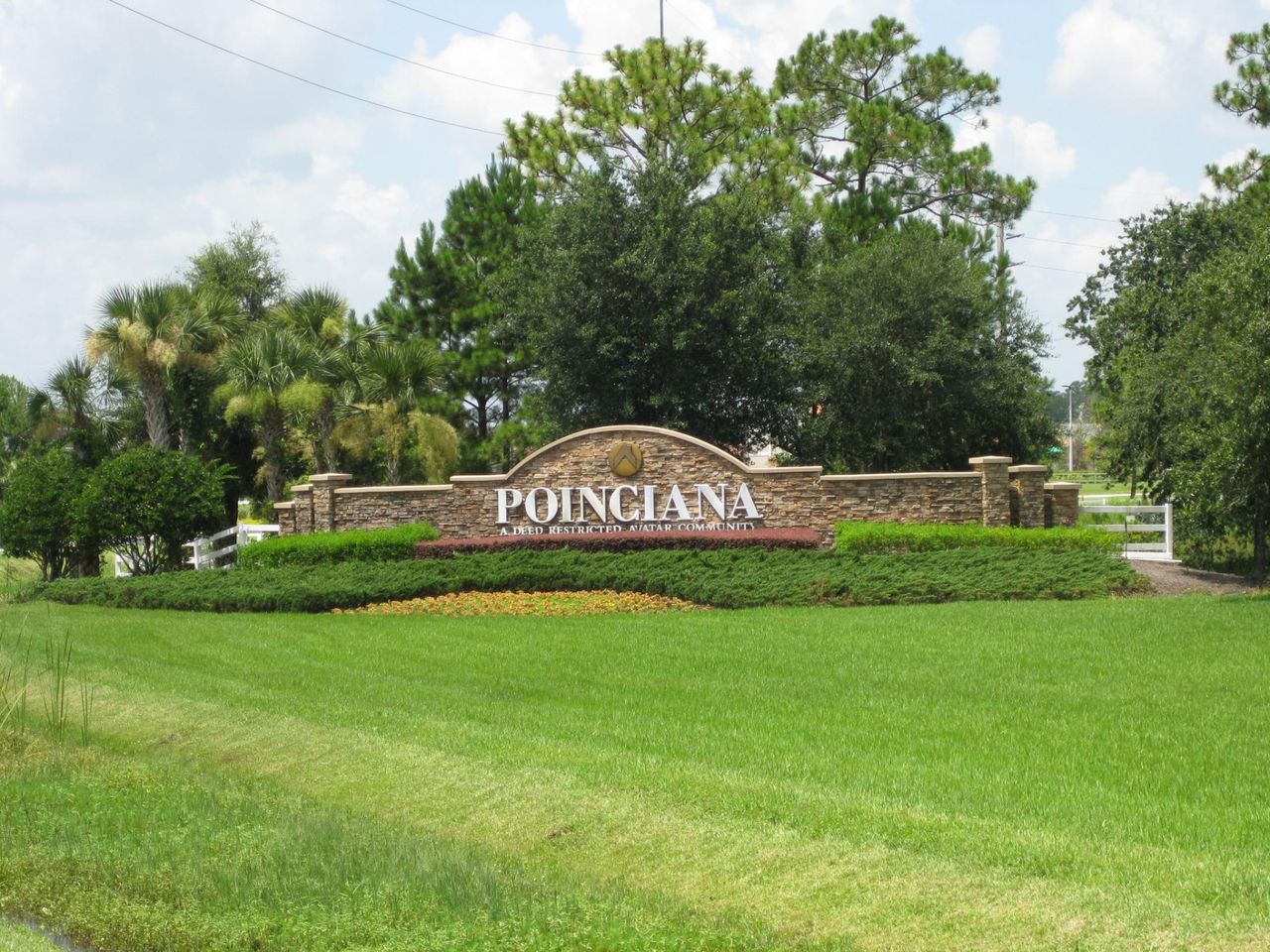 Entrance to the Poinciana-Osceola County community in Kissimmee, FL, featuring signage and landscaping (Image 2). Entrance to the Poinciana-Osceola County community in Kissimmee, FL, featuring signage and landscaping (Image 2).