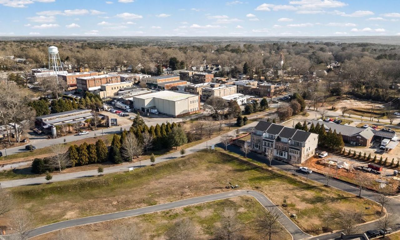 Aerial view of the Overlook at Gin Property community in Senoia, GA, showing layout and nearby surroundings (Image 2). Aerial view of the Overlook at Gin Property community in Senoia, GA, showing layout and nearby surroundings (Image 2).