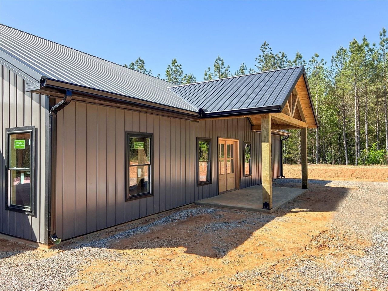 Front exterior of a new home in , Lenoir, NC, highlighting curb appeal (Image 2).