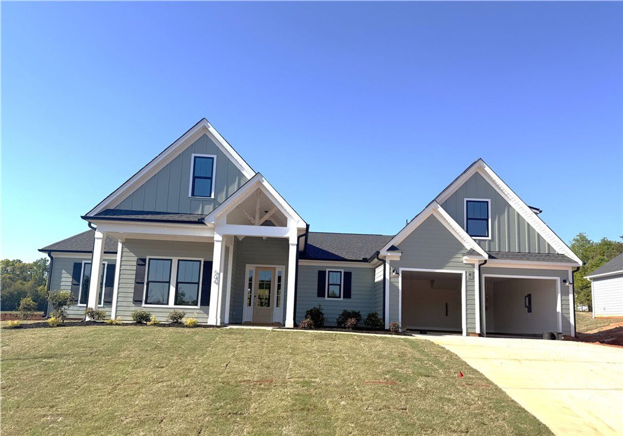 This newly constructed home features a welcoming c