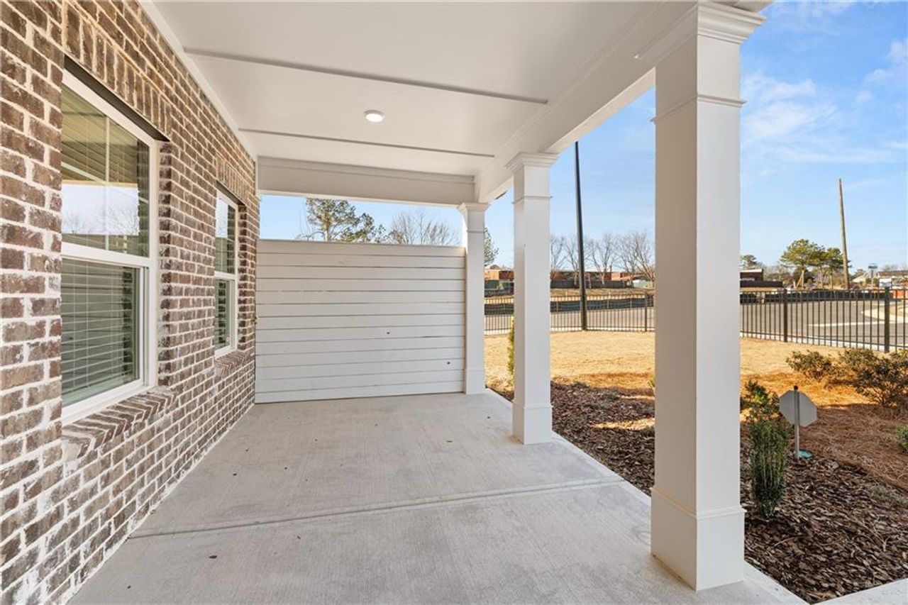 Exterior details and patio area of a home in Lake Carlton, Loganville (Image 2). Exterior details and patio area of a home in Lake Carlton, Loganville (Image 2).