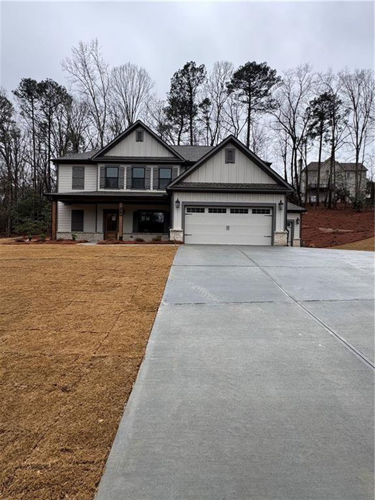 Front exterior of a new home in Red Oak Ridge, Loganville, GA, highlighting curb appeal (Image 2).