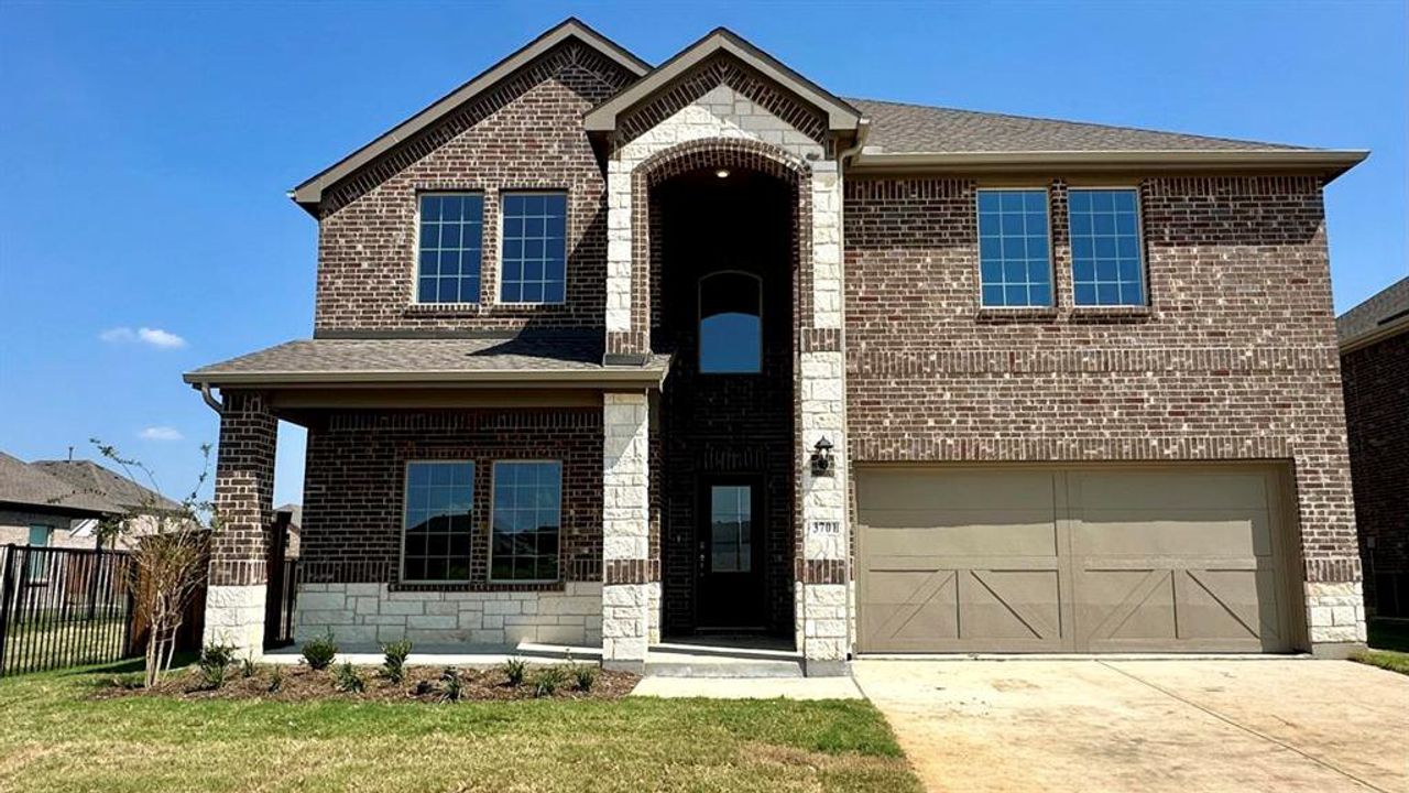 View of front of property with brick siding and driveway View of front of property with brick siding and driveway