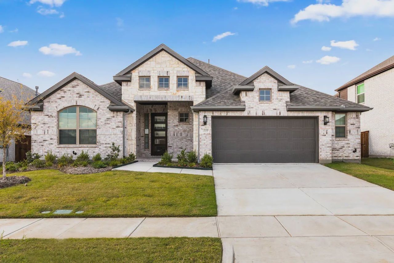 Front exterior of a new home in Las Lomas, Forney, TX, highlighting curb appeal (Image 2).
