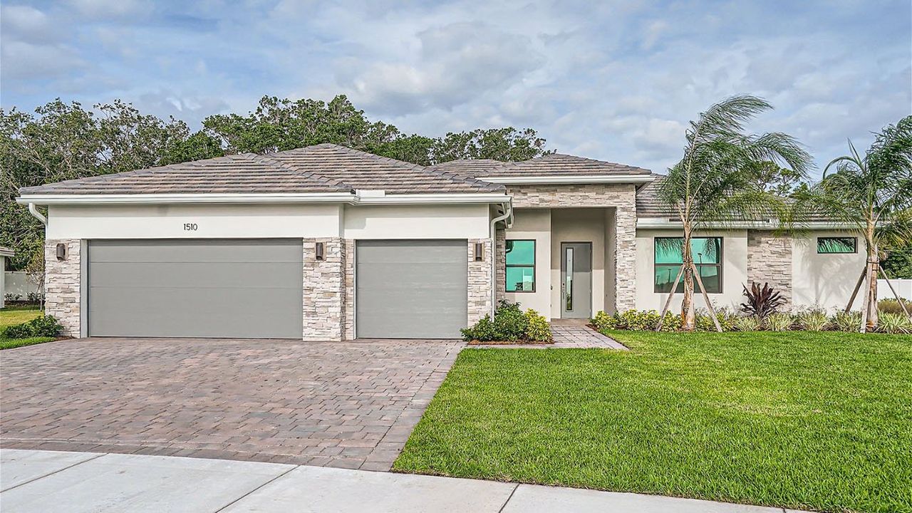 Representative exterior photo of a completed home built from the Bellister by D.R. Horton in Estrella Square, Homestead, FL (Image 2).
