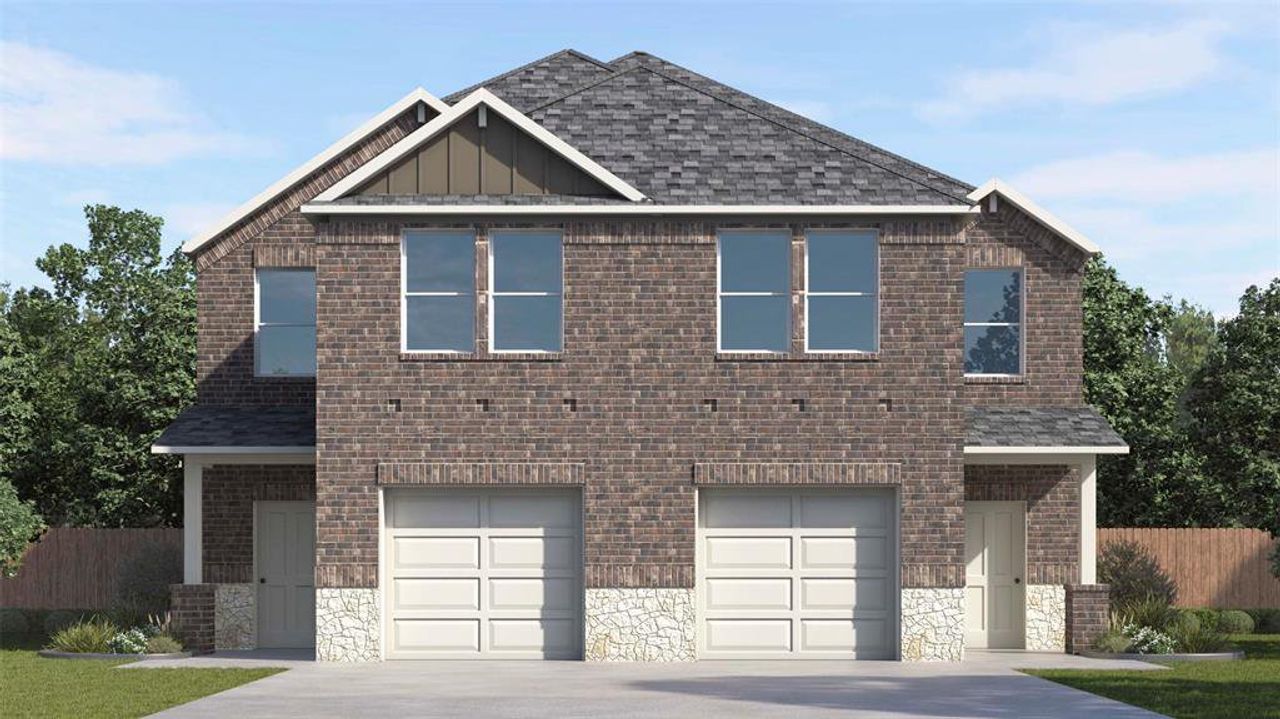 Duplex-style property featuring a dark brick facade with light stone accents