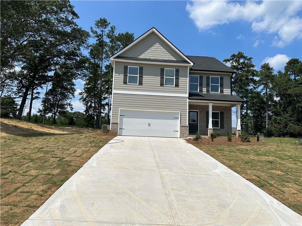Front exterior of a new home in , Dallas, GA, highlighting curb appeal (Image 2).
