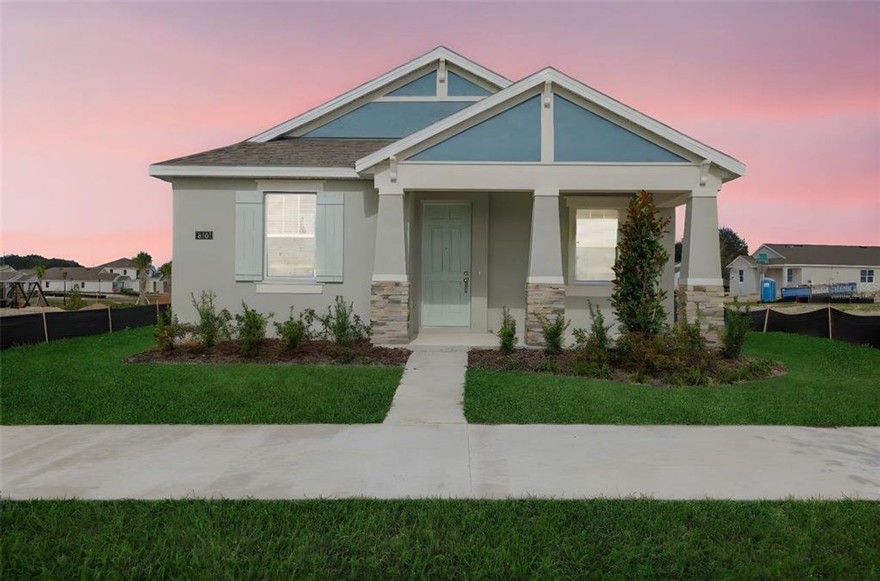 Front exterior of a new home in Crossroads at Kelly Park, Apopka, FL, highlighting curb appeal (Image 2).