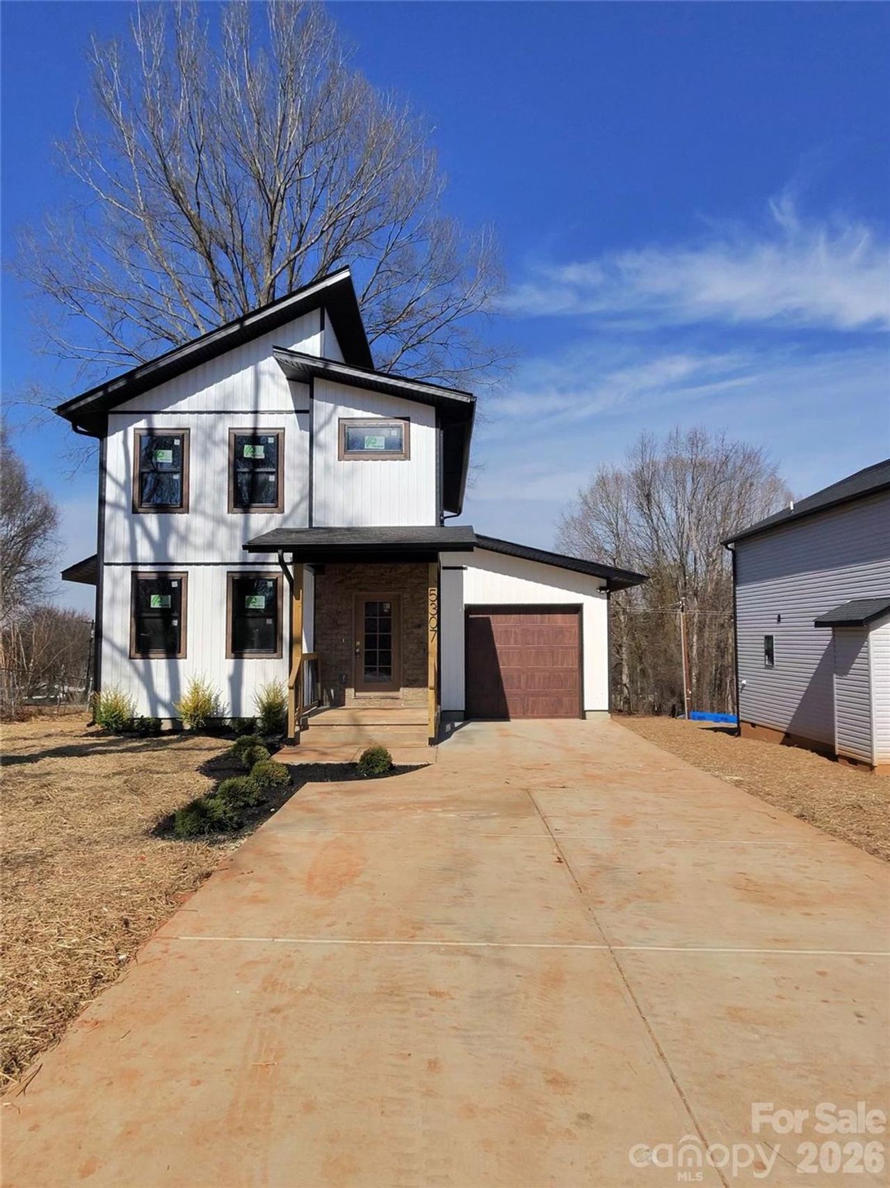 Front exterior of a new home in , Concord, NC, highlighting curb appeal (Image 2).