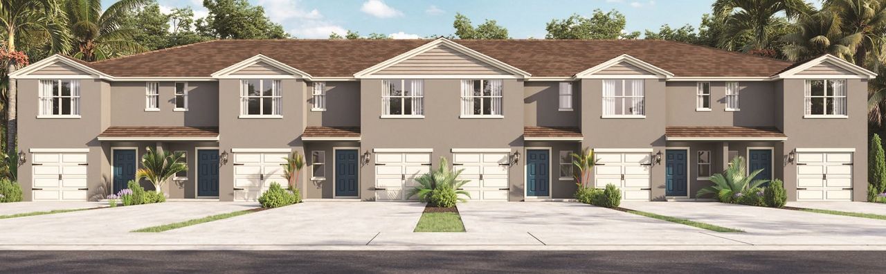 Front exterior of a new home in Horse Creek at Crosswinds Townhomes, Davenport, FL, highlighting curb appeal (Image 2).