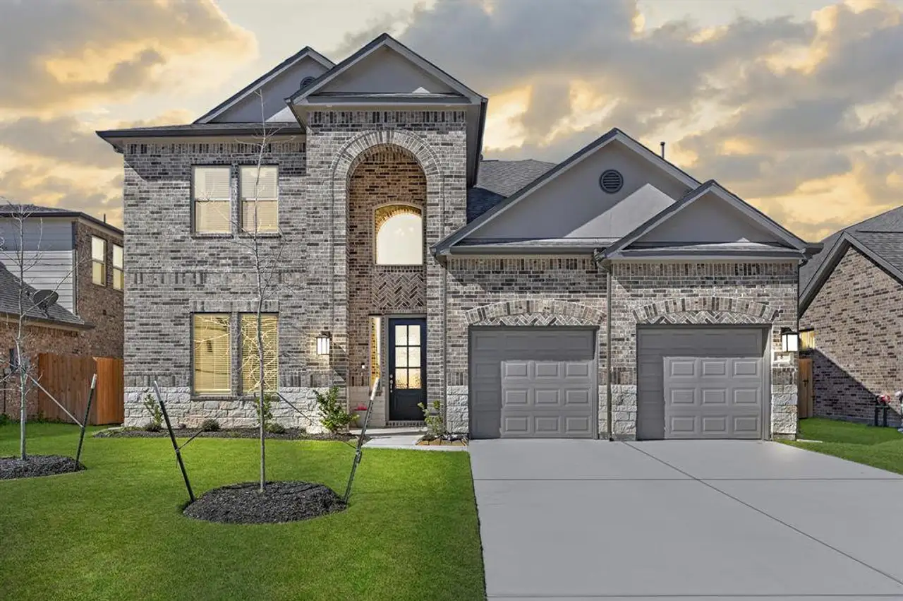 Front exterior of a home in the Rodeo Palms community, located in Manvel, TX (Image 2).