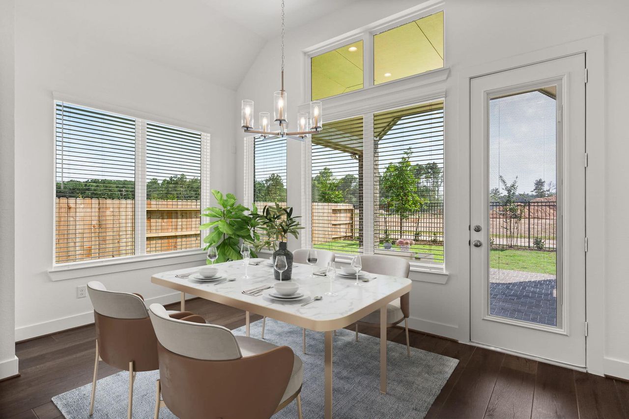 Representative furnished interior of a home built from the Marion by Chesmar Homes in Sunterra, Katy (Image 2).