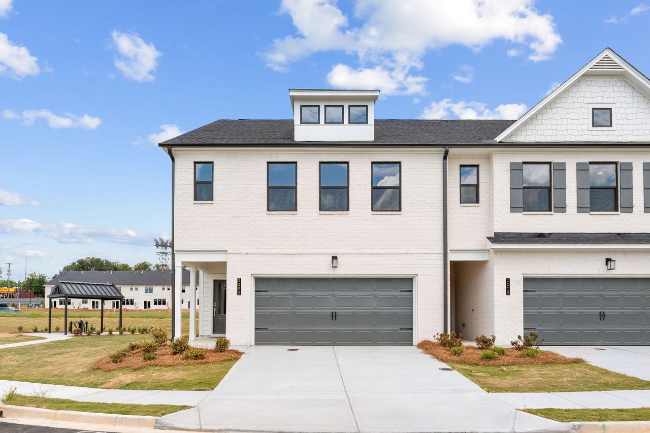 Front exterior of a new home in Magnolia Square, Austell, GA, highlighting curb appeal (Image 2). Front exterior of a new home in Magnolia Square, Austell, GA, highlighting curb appeal (Image 2).