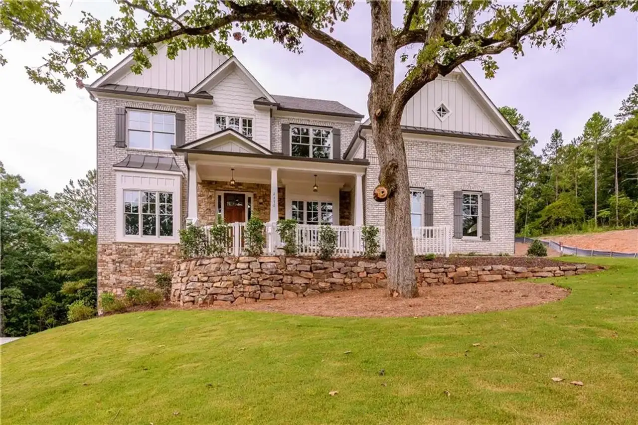 Front exterior of a new home in , Cumming, GA, highlighting curb appeal (Image 2). Front exterior of a new home in , Cumming, GA, highlighting curb appeal (Image 2).