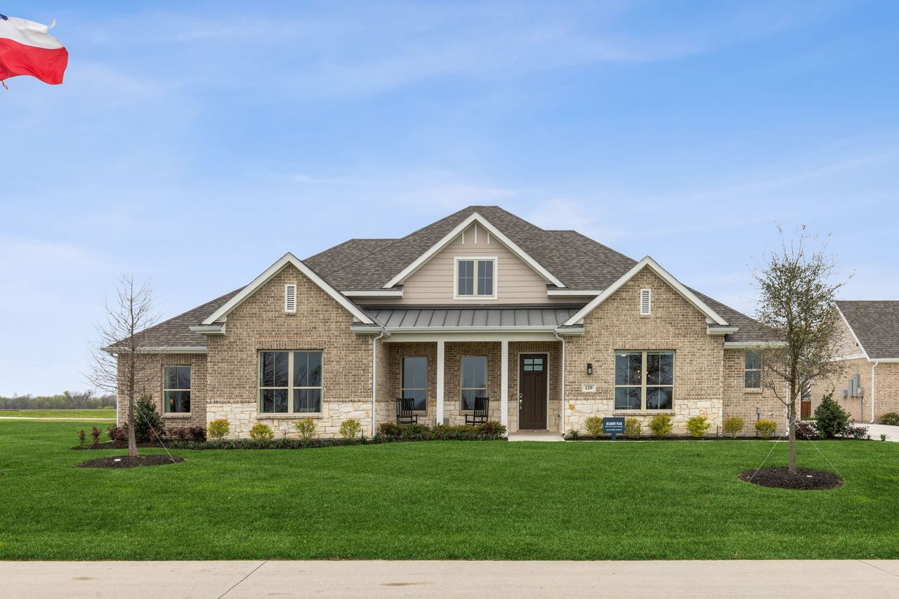 Front exterior of a new home in Lakeway Estates, Waxahachie, TX, highlighting curb appeal (Image 2).