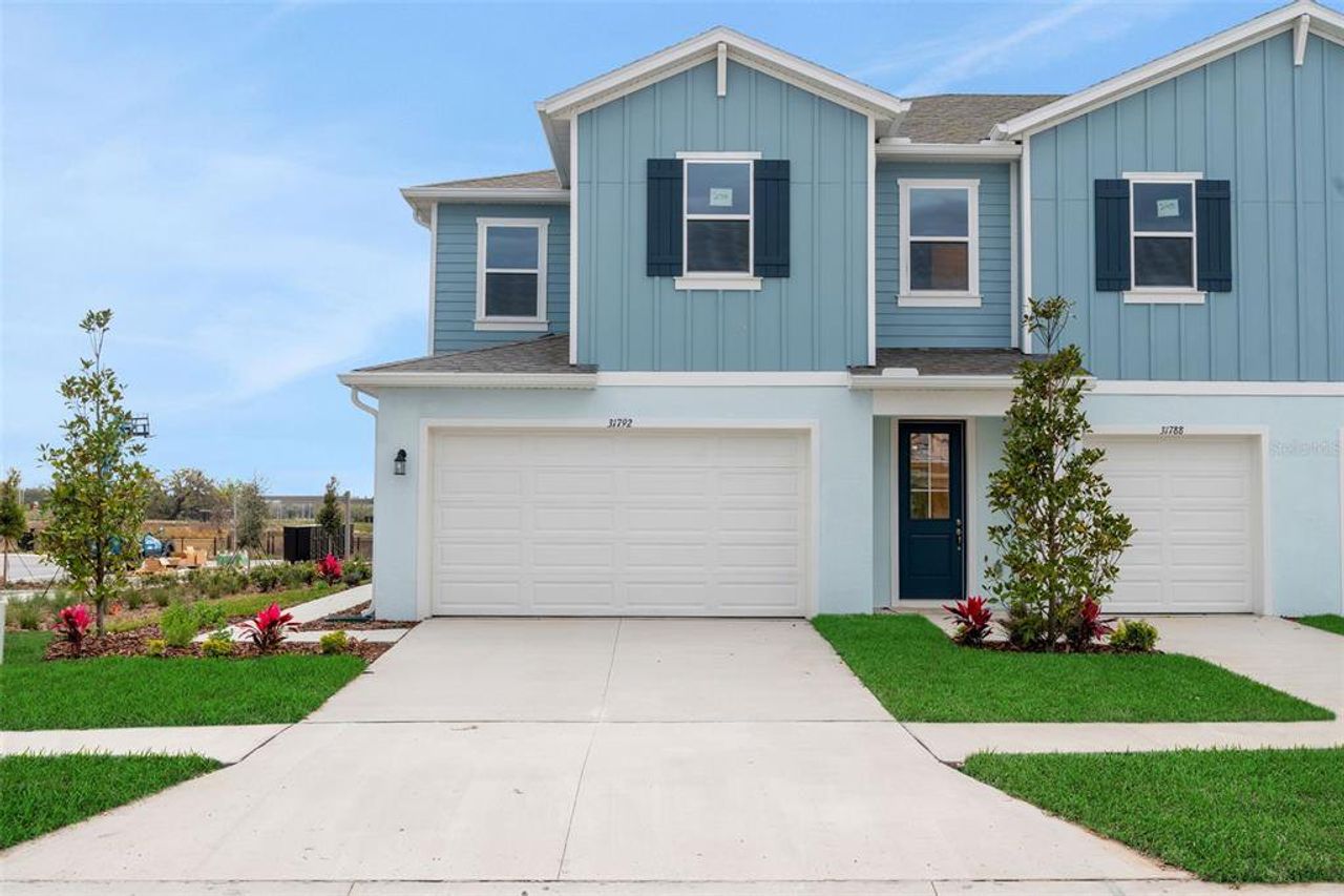 Front exterior of a new home in Shores at Mirada, San Antonio, FL, highlighting curb appeal (Image 2). Front exterior of a new home in Shores at Mirada, San Antonio, FL, highlighting curb appeal (Image 2).