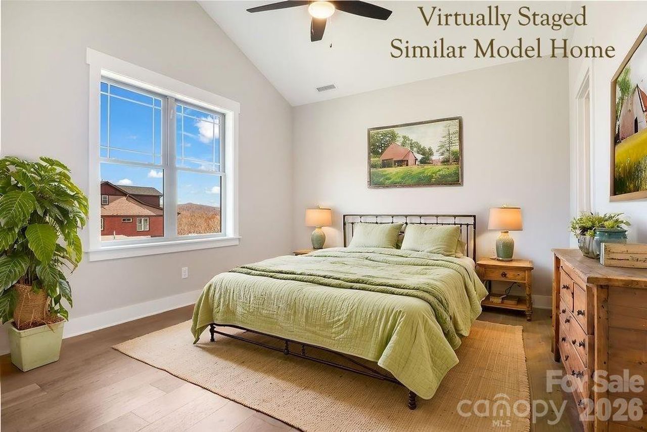 Guest bedroom with vaulted ceiling and en suite bathroom