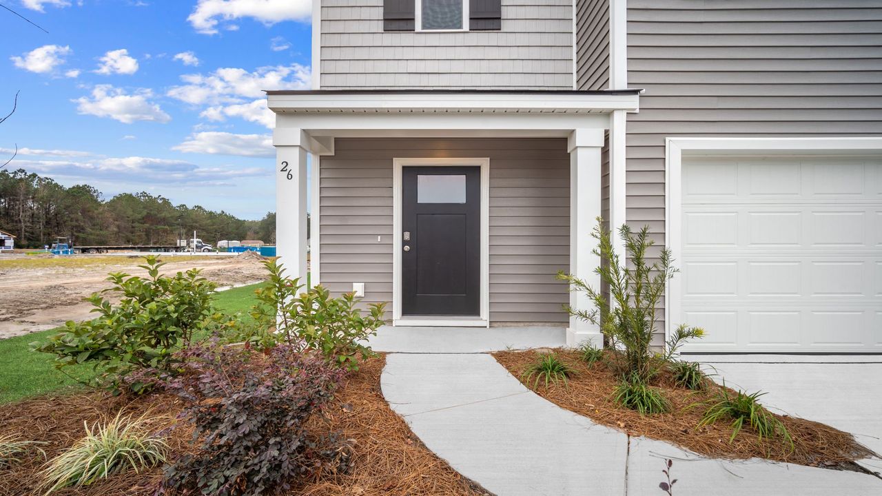 Exterior details and patio area of a home in The Groves at Bees Creek, Ridgeland (Image 2).