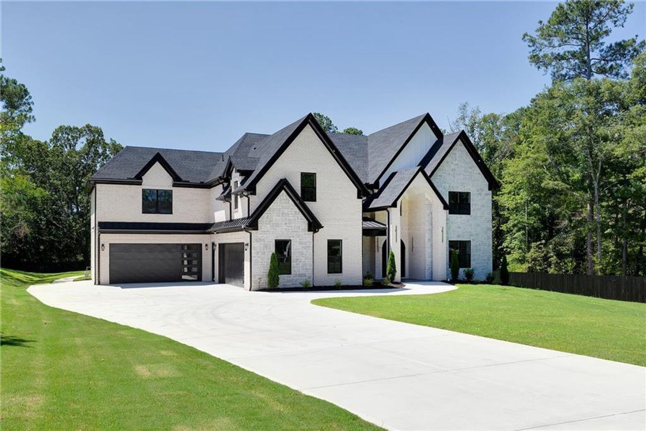Front exterior of a new home in , Suwanee, GA, highlighting curb appeal (Image 2).