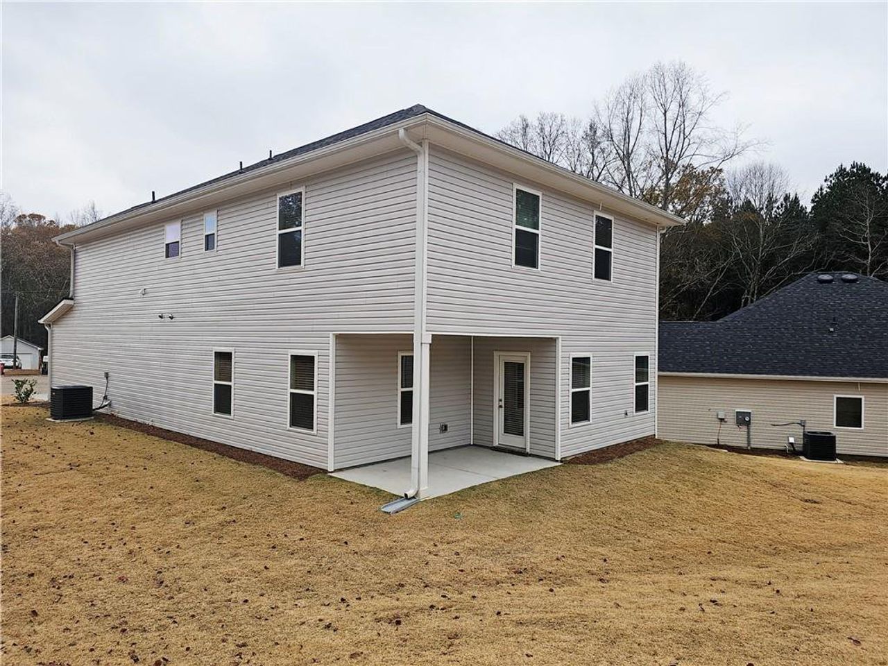 Exterior details and patio area of a home in Scarlett Place, Bowdon (Image 2).