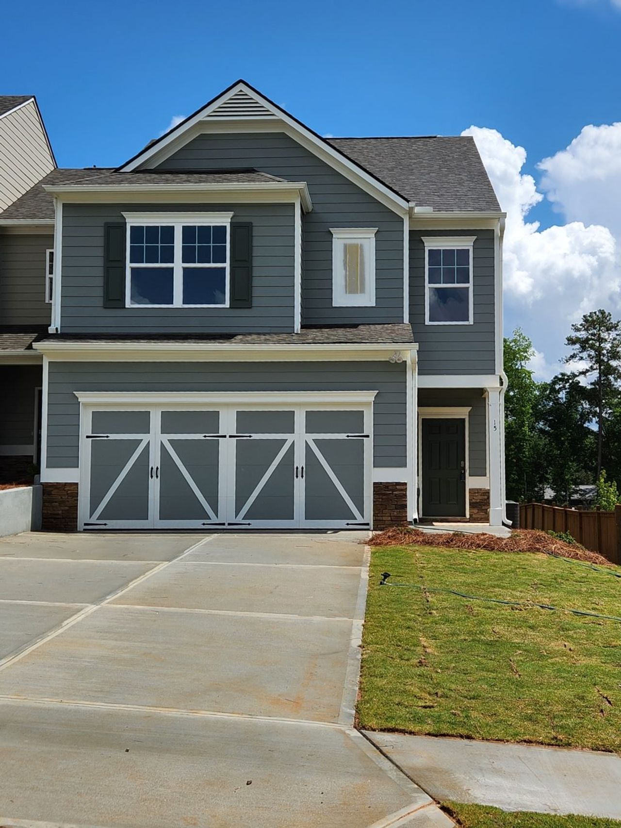 Front exterior of a new home in The Retreat at Browns Ridge, Newnan, GA, highlighting curb appeal (Image 2).