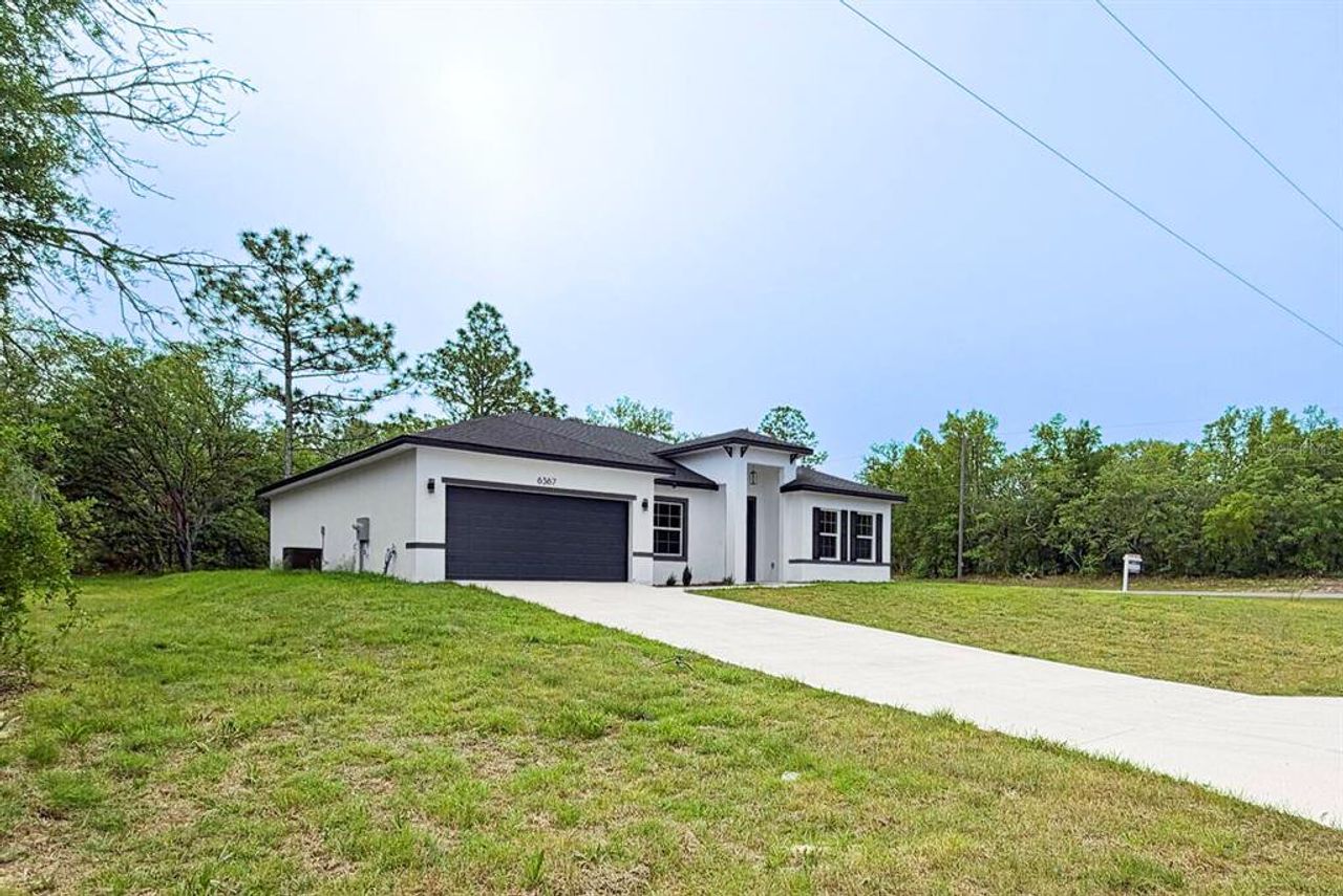 Front exterior of a new home in , Citrus Springs, FL, highlighting curb appeal (Image 2).