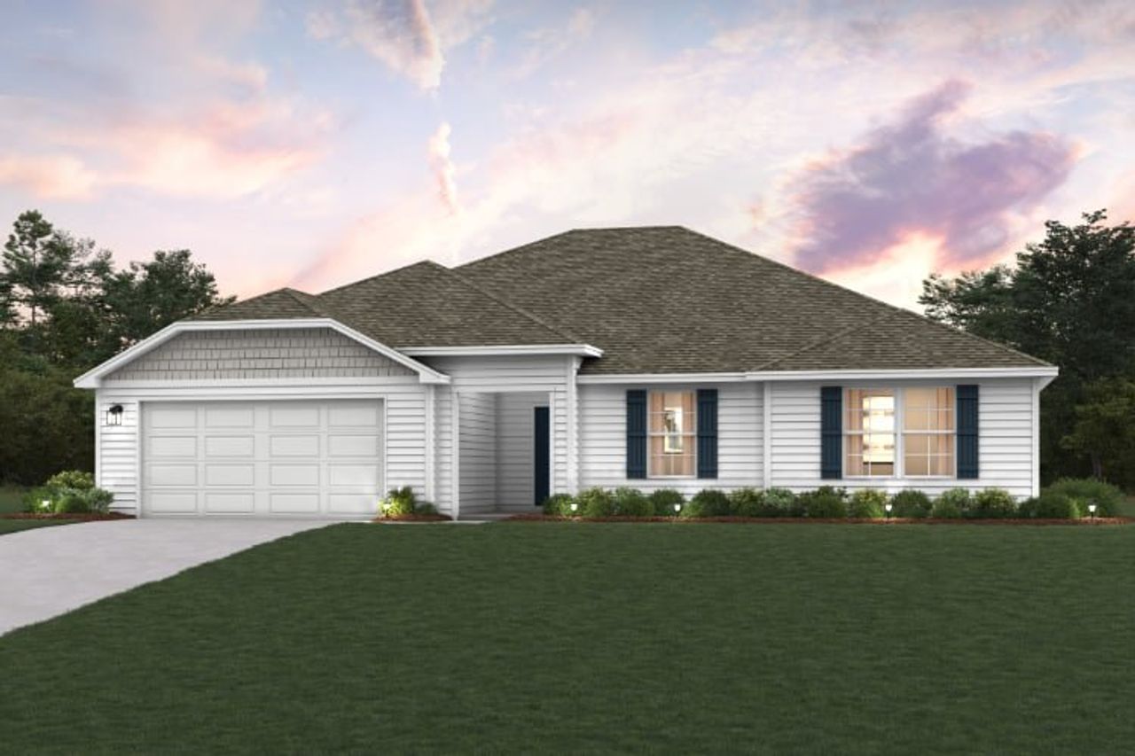 A house with a lawn in front of it.