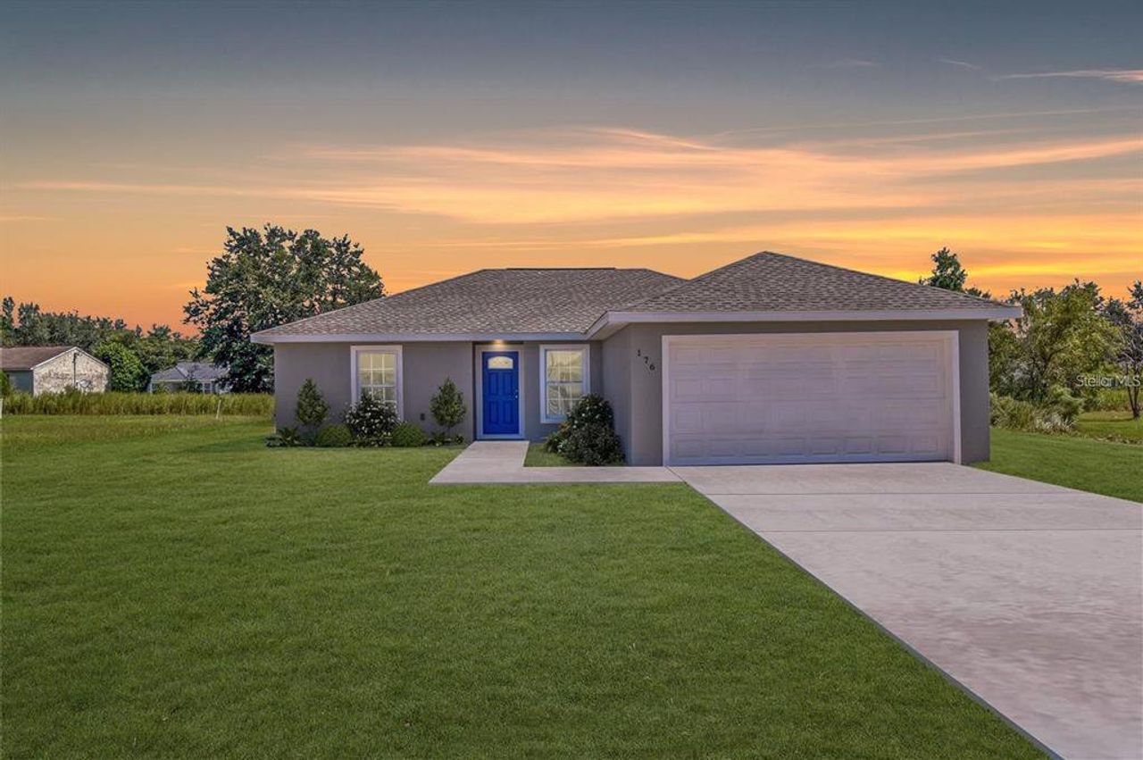 Front exterior of a new home in , Dunnellon, FL, highlighting curb appeal (Image 2).