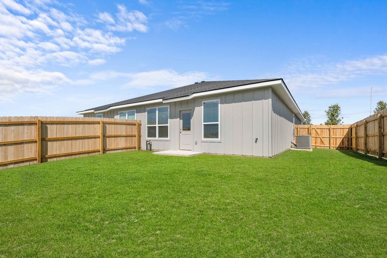 Exterior details and patio area of a home in The Preserve At Thousand Oaks Duplexes, Killeen (Image 2).