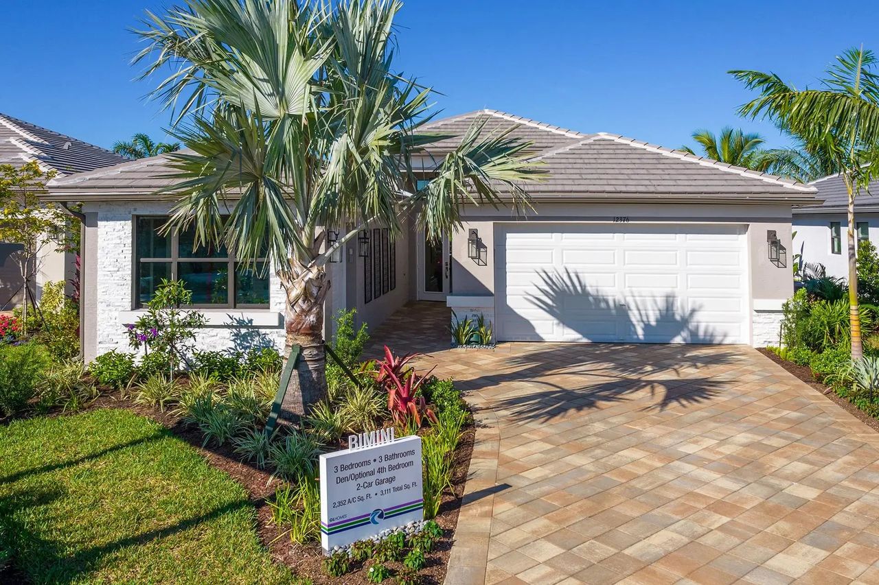 Front exterior of a new home in Valencia Parc at Riverland, Port St. Lucie, FL, highlighting curb appeal (Image 2).
