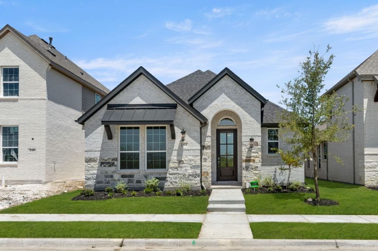 Representative exterior photo of a completed home built from the Cypress by UnionMain Homes in Edgewater, Fate, TX (Image 2). Representative exterior photo of a completed home built from the Cypress by UnionMain Homes in Edgewater, Fate, TX (Image 2).