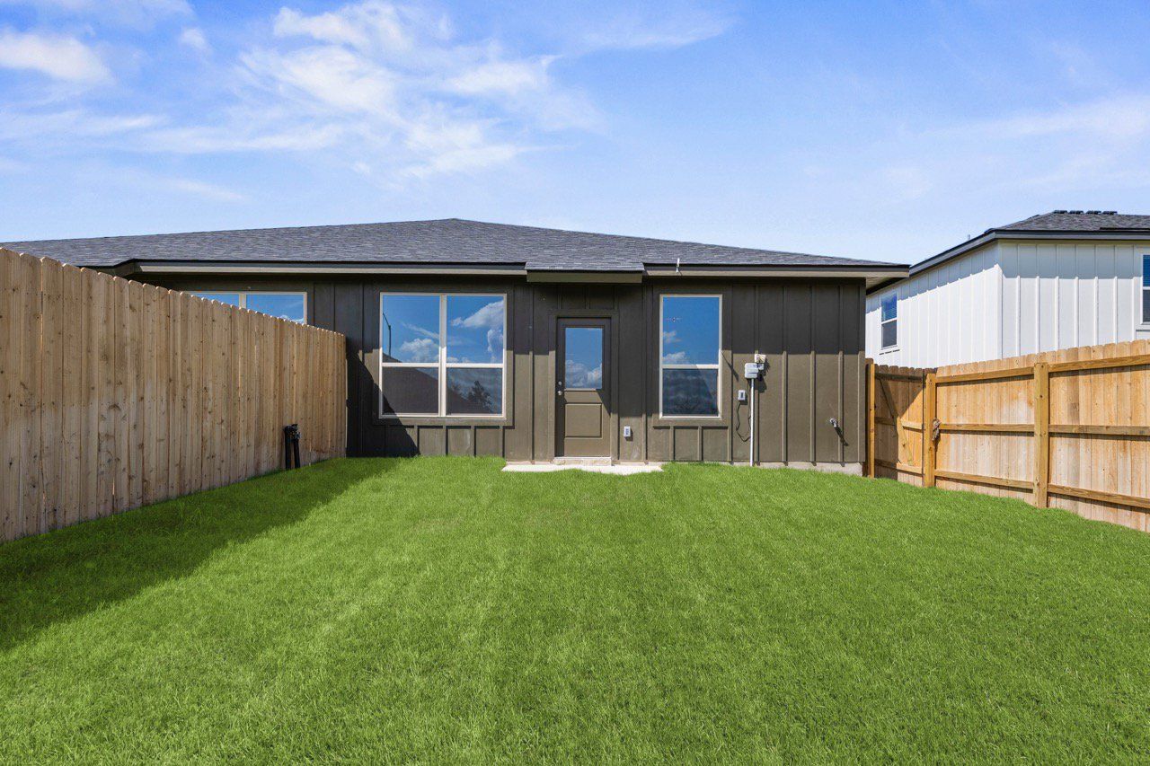 Exterior details and patio area of a home in The Preserve at Thousand Oaks Duplexes, Killeen (Image 2).