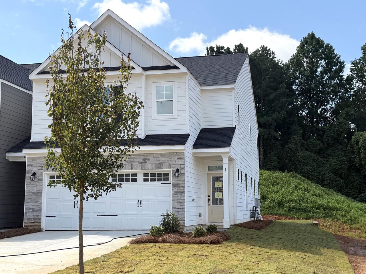 Front exterior of a new home in Villas at Dawsonville Townhomes, Dawsonville, GA, highlighting curb appeal (Image 2).