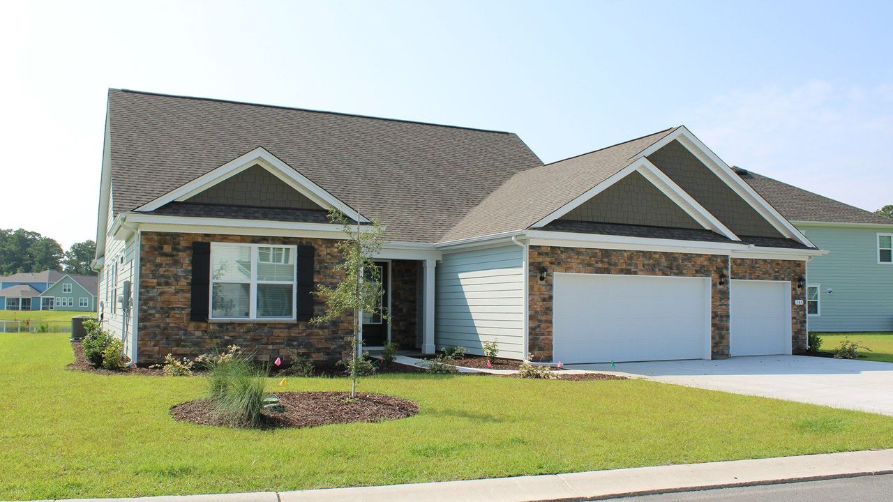 Representative exterior photo of a completed home built from the CUMBERLAND by D.R. Horton in Brunswick Plantation, Calabash, NC (Image 2).