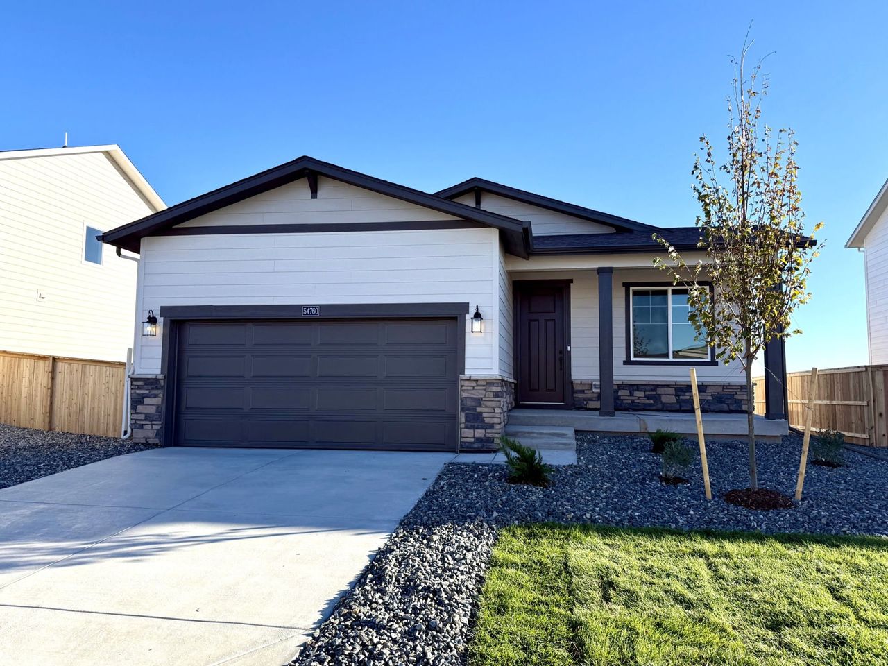 Front exterior of a new home in Wolf Creek Run West, Strasburg, CO, highlighting curb appeal (Image 2).