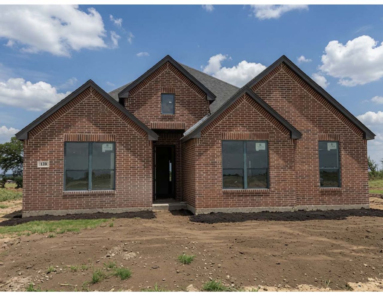 Front exterior of a new home in Stagecoach Crossing, Bridgeport, TX, highlighting curb appeal (Image 2). Front exterior of a new home in Stagecoach Crossing, Bridgeport, TX, highlighting curb appeal (Image 2).
