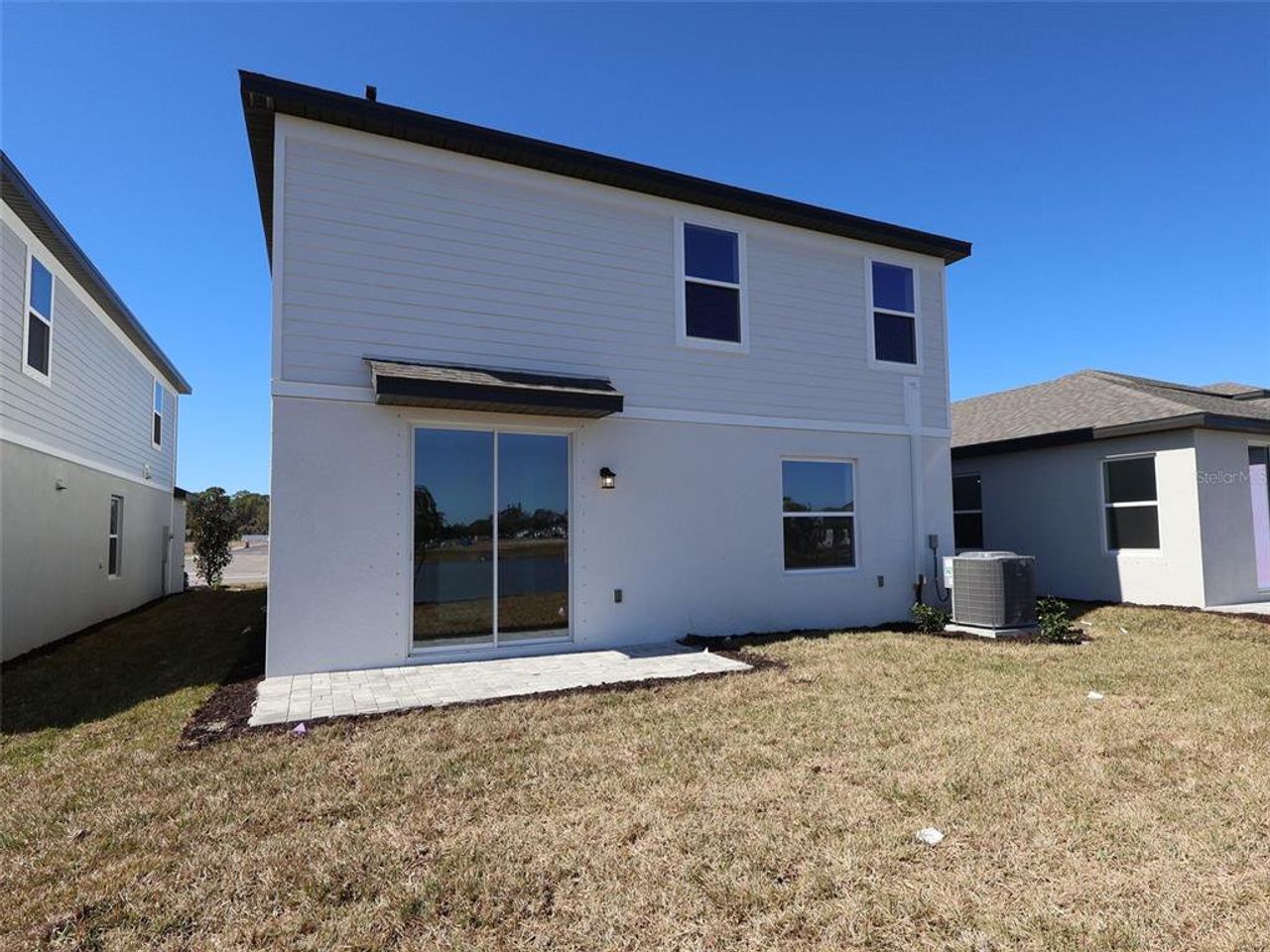 Exterior details and patio area of a home in Southpointe, Palmetto (Image 2).