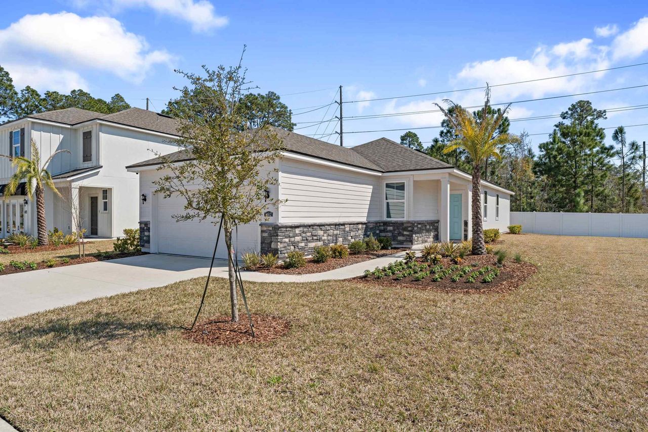 A house with trees and grass. A house with trees and grass.
