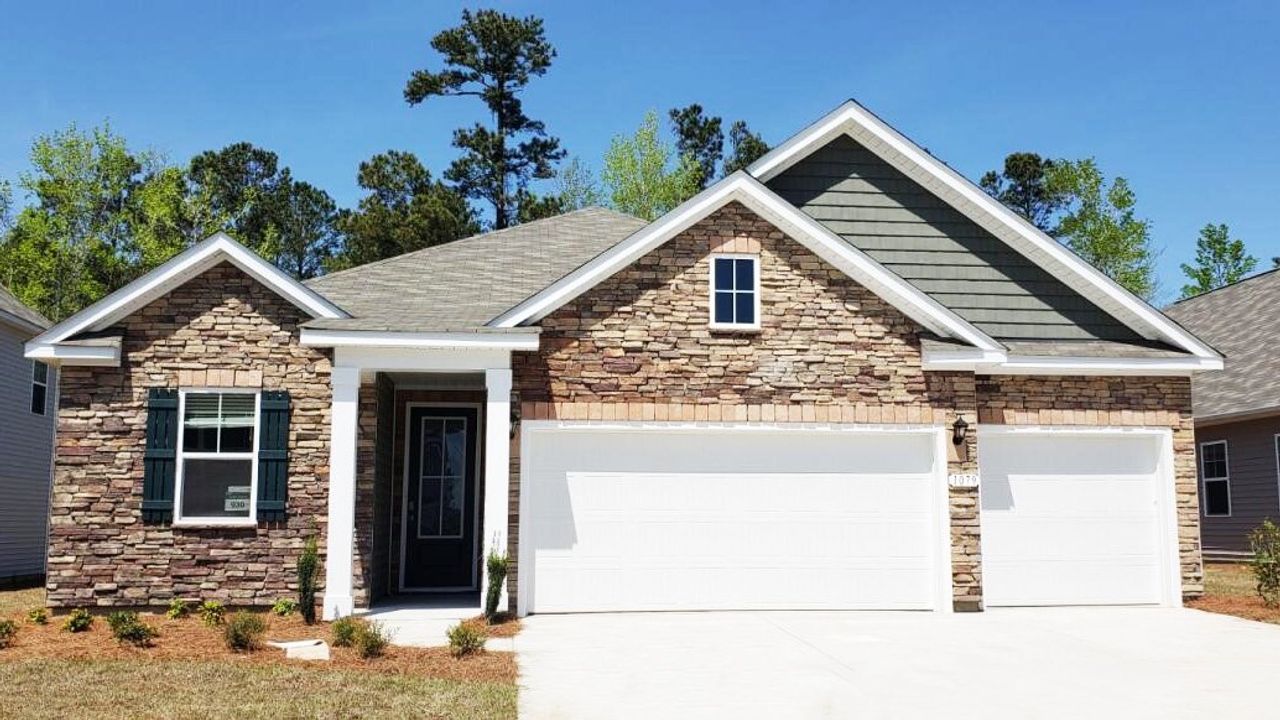 Representative exterior photo of a completed home built from the Madison by D.R. Horton in Auberon Woods, Conway, SC (Image 2). Representative exterior photo of a completed home built from the Madison by D.R. Horton in Auberon Woods, Conway, SC (Image 2).