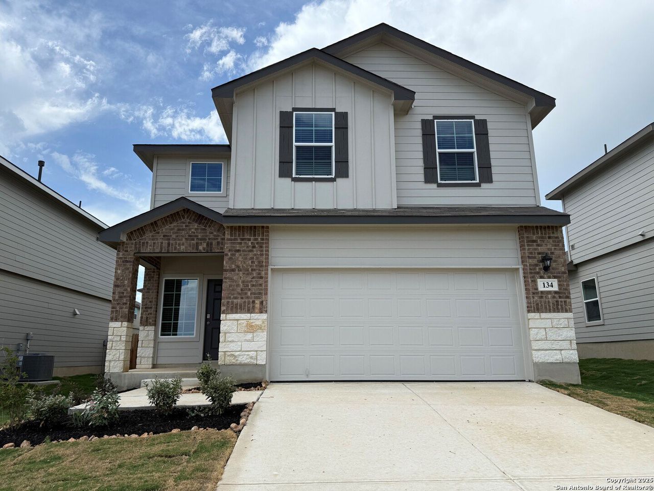 Front exterior of a new home in Redbird Ranch, San Antonio, TX, highlighting curb appeal (Image 2).
