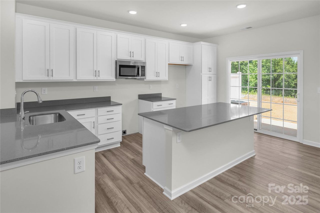 Magnolia Gourmet Kitchen w Oversized Island