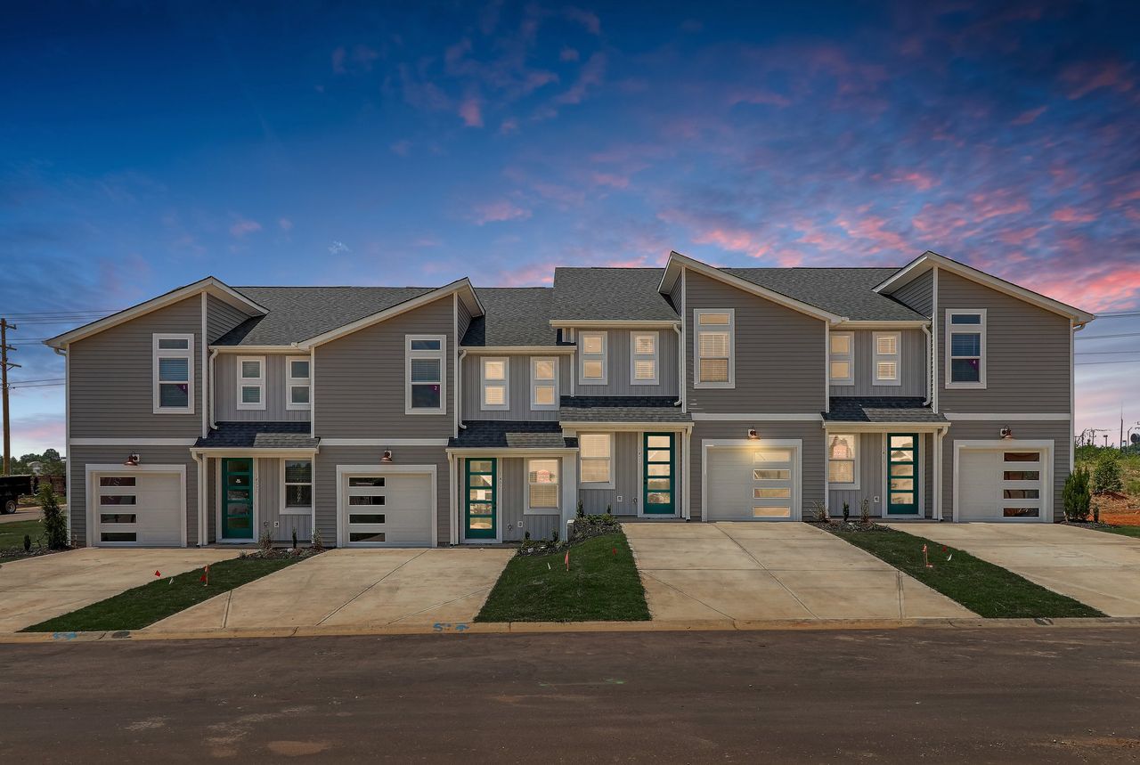 Front exterior of a new home in Westgate Village Townes, Spartanburg, SC, highlighting curb appeal (Image 2). Front exterior of a new home in Westgate Village Townes, Spartanburg, SC, highlighting curb appeal (Image 2).